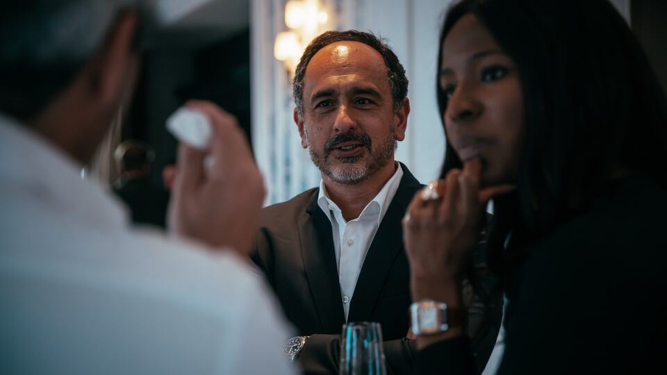 Guests in conversation during a PREIS networking session