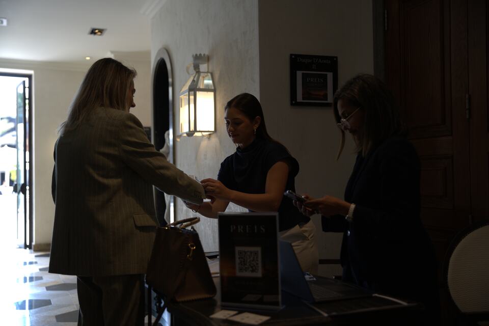 Guests checking in at the PREIS event registration desk