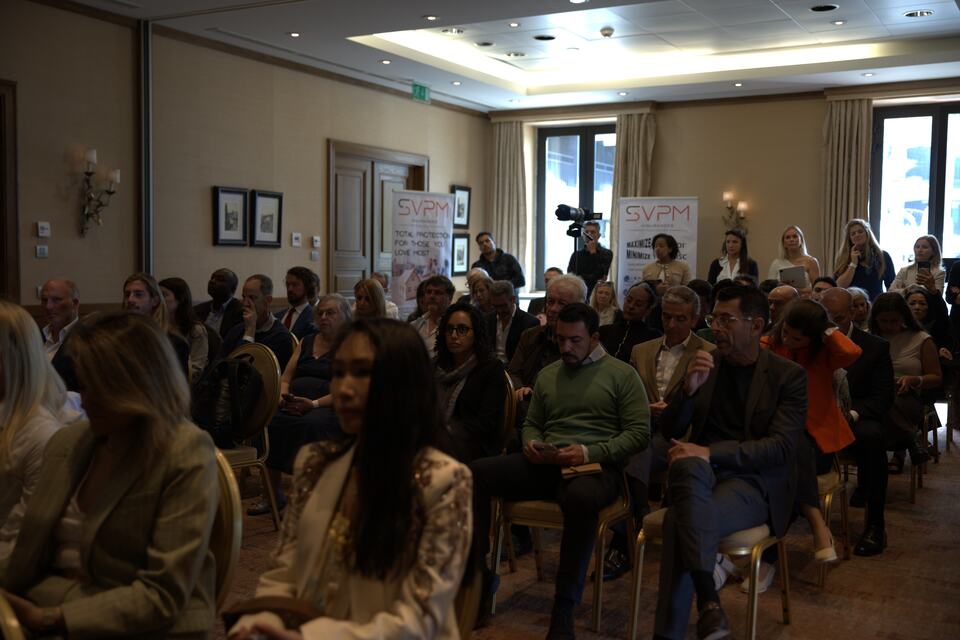 The PREIS conference audience seated in the main event room