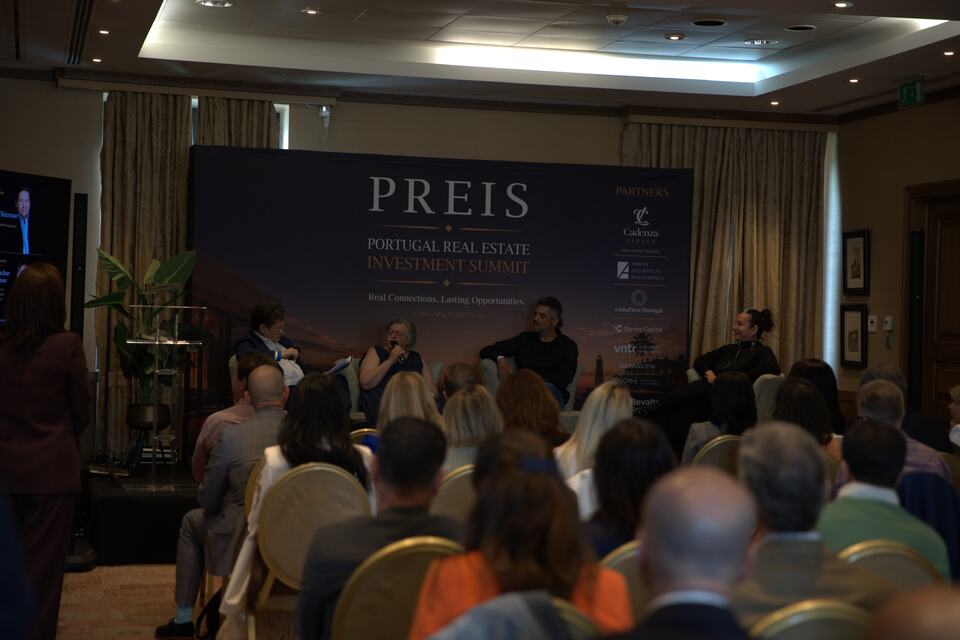 A PREIS panel discussion viewed from the back of the audience
